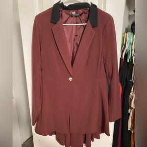 Beautiful maroon blazer with back detailing worn one time